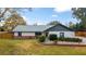 Ranch style home with brick facade, new roof, and well-maintained lawn at 6292 Se 87Th St, Ocala, FL 34472