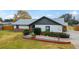 Single story home with grey accents, landscaping, and a spacious yard at 6292 Se 87Th St, Ocala, FL 34472