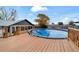 Spacious wooden deck surrounding an above-ground pool at 6292 Se 87Th St, Ocala, FL 34472