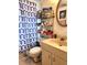 Well-lit bathroom with a storage rack at 8178 Fairways Cir # U201, Ocala, FL 34472