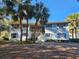 Inviting condo building with palm trees and landscaping at 8178 Fairways Cir # U201, Ocala, FL 34472