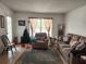 Cozy living room featuring a sofa and recliner at 8178 Fairways Cir # U201, Ocala, FL 34472
