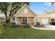 Cute yellow house with a covered porch and well-manicured lawn at 8450 Sw 90Th St # A, Ocala, FL 34481