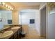 Bathroom with double vanity and shower at 8457 Sw 138Th Pl, Ocala, FL 34473