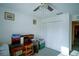 Bright bedroom with large closet and home office setup at 8457 Sw 138Th Pl, Ocala, FL 34473