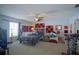 Bedroom with a bed, exercise bike, and wall decor at 8457 Sw 138Th Pl, Ocala, FL 34473