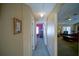 Bright hallway with neutral walls, carpet, and access to other rooms at 8457 Sw 138Th Pl, Ocala, FL 34473