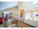 View of kitchen, living room, and laundry room at 8457 Sw 138Th Pl, Ocala, FL 34473
