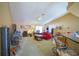 Spacious living room with red sofa and fireplace at 8457 Sw 138Th Pl, Ocala, FL 34473