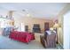Living room with red sofa and built-in shelving at 8457 Sw 138Th Pl, Ocala, FL 34473