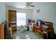 Home office with built in shelving, desk, and window at 8457 Sw 138Th Pl, Ocala, FL 34473