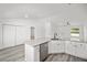 Modern kitchen with white cabinets, granite countertops, and stainless steel appliances at 89 Malauka Pass Crse, Ocklawaha, FL 32179