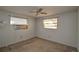 Simple bedroom with brown carpet and window at 10655 Ne 224Th Place Rd, Fort Mc Coy, FL 32134