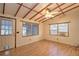 Living room with wood flooring and exposed beams at 10655 Ne 224Th Place Rd, Fort Mc Coy, FL 32134