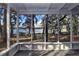 Spacious screened porch overlooking the lake at 10655 Ne 224Th Place Rd, Fort Mc Coy, FL 32134
