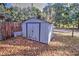 Metal storage shed in the backyard, offering extra storage space at 10655 Ne 224Th Place Rd, Fort Mc Coy, FL 32134
