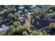 Aerial view of house and lot with surrounding trees at 11360 Se 188Th Ave, Ocklawaha, FL 32179
