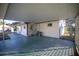 Covered carport with concrete flooring and AC unit at 11360 Se 188Th Ave, Ocklawaha, FL 32179