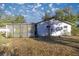 White house exterior with lattice and spacious yard at 11360 Se 188Th Ave, Ocklawaha, FL 32179