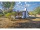 Cozy one-story house with a covered porch and fenced yard at 11360 Se 188Th Ave, Ocklawaha, FL 32179
