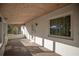 Covered and screened porch with carpet flooring at 11360 Se 188Th Ave, Ocklawaha, FL 32179