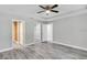 Spacious bedroom with ceiling fan and vinyl plank flooring at 13460 Sw 107 St, Dunnellon, FL 34432