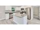 Modern kitchen with stainless steel appliances and granite countertops at 13460 Sw 107 St, Dunnellon, FL 34432
