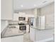 Modern kitchen with stainless steel appliances and granite countertops at 13460 Sw 107 St, Dunnellon, FL 34432