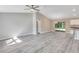 Open living room with vinyl plank flooring and access to backyard at 13460 Sw 107 St, Dunnellon, FL 34432