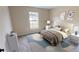 Cozy bedroom with a queen-size bed and neutral decor at 1697 Ne 161St St, Citra, FL 32113