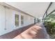Covered patio with brick pavers and exterior access at 2528 Se 15Th St, Ocala, FL 34471