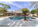 Relaxing kidney-shaped pool surrounded by a large patio and trees at 2528 Se 15Th St, Ocala, FL 34471