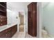Bathroom with double vanity, toilet and access to bedroom at 2528 Se 15Th St, Ocala, FL 34471