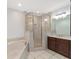 Bathroom with double vanity, shower, and separate tub at 2528 Se 15Th St, Ocala, FL 34471