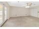 Large bedroom with patio access and ceiling fan at 2528 Se 15Th St, Ocala, FL 34471