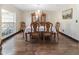 Formal dining room featuring hardwood floors and a stunning chandelier at 2528 Se 15Th St, Ocala, FL 34471