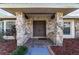 Double front doors with stone accents and a tiled entryway at 2528 Se 15Th St, Ocala, FL 34471
