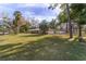 Spacious front yard with mature trees and a large lawn at 2528 Se 15Th St, Ocala, FL 34471