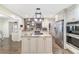 Updated kitchen with island, granite countertops, and stainless steel appliances at 2528 Se 15Th St, Ocala, FL 34471