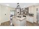 Spacious kitchen with granite island, updated cabinetry, and modern appliances at 2528 Se 15Th St, Ocala, FL 34471
