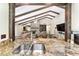 Granite countertop kitchen with breakfast bar and view of living room at 2528 Se 15Th St, Ocala, FL 34471