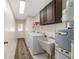 Laundry room with washer, dryer, utility sink, and cabinets at 2528 Se 15Th St, Ocala, FL 34471