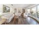 Bright living room with hardwood floors, ample seating, and a view to the entryway at 2528 Se 15Th St, Ocala, FL 34471