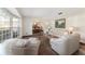 Living area with hardwood floors, neutral color palette, and bay window providing natural light at 2528 Se 15Th St, Ocala, FL 34471