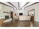 Living room boasting hardwood floors, a stone fireplace, and an open concept design at 2528 Se 15Th St, Ocala, FL 34471