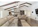 Living room with hardwood floors, a stone fireplace, built-in shelving, and comfortable seating at 2528 Se 15Th St, Ocala, FL 34471