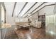 Vaulted ceiling living room with stone fireplace and hardwood floors at 2528 Se 15Th St, Ocala, FL 34471