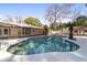 Spacious pool area with surrounding patio and lush landscaping at 2528 Se 15Th St, Ocala, FL 34471