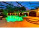 Expansive pool and spa with a covered patio at twilight at 2802 Se 28Th St, Ocala, FL 34471