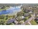 Aerial view showcasing lake and neighborhood at 37352 Turner Dr, Umatilla, FL 32784